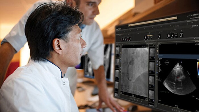 Clinician checking ultrasound scan from monitor of clinical tool